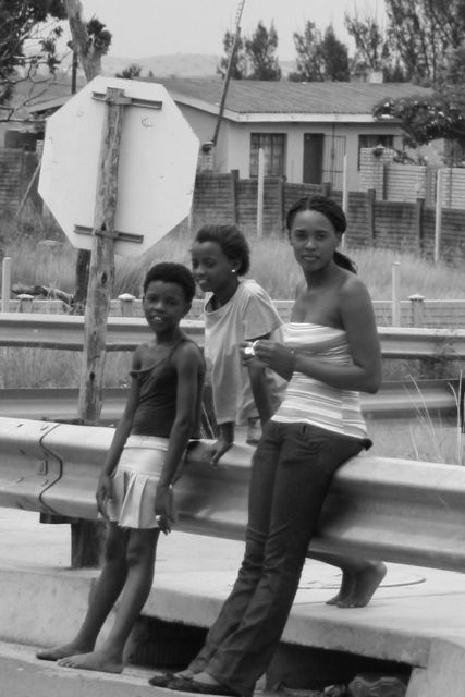 Local people of South Africa: On the way to Hluhluwe Animal Safari, the lives of the local people outside the big city are much more different. Their style of life and housing is much different.