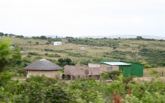 Zulu housing style: The cylindrical building is the remaining aspect of the Zulu style in S. Africa. The building is served as a living room, separated from the main house.
